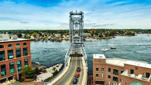 An aerial view of a historic bridge over the water in Portsmouth, New Hampshire