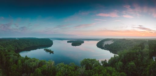 A panoramic aerial view of a beautiful lake at sunset in Northern Michigan