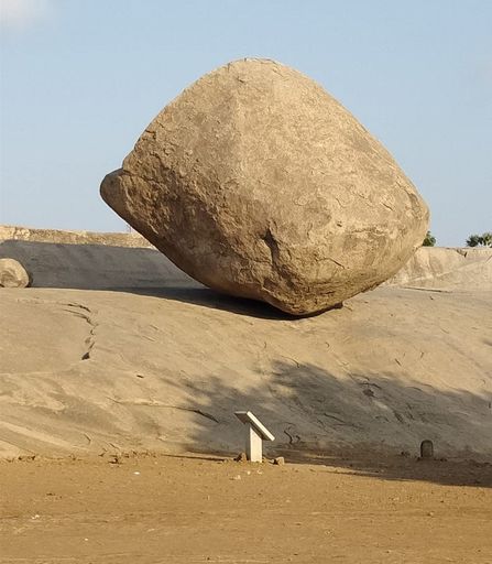 A vertical shot of Krishna's Butter Ball in Mahabalipuram, India