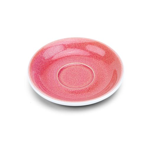 A closeup of a pink ceramic plate on a white background