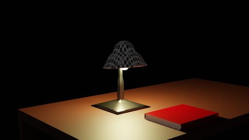 A shot of a lamp and a red book on a wooden table