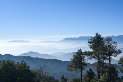 A mesmerizing view of a beautiful mountainous landscape under a cloudy sky