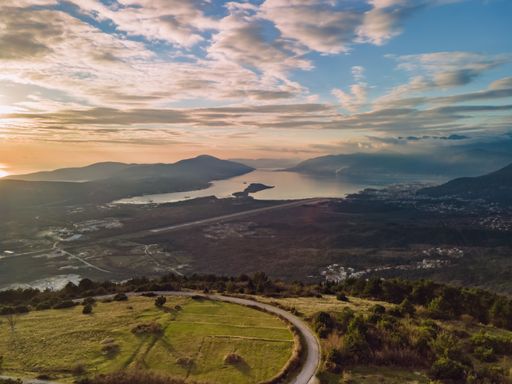 An aerial view of the green field to Tivat Bay in Montenegro