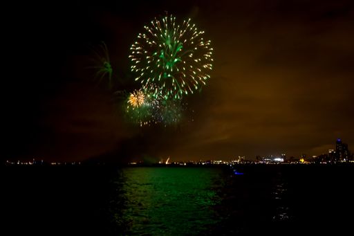 A beautiful view of colorful fireworks over the Lake Michigan near Chicago, IL in the night sky