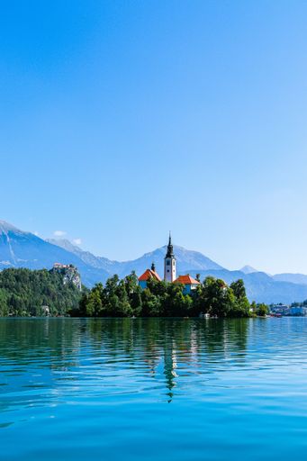 A vertical shot of Lake Bled and Bled Castle in Krajna, Slovenia