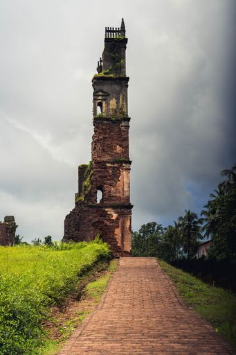 A vertical shot of the historic St. Augustine Tower, a 16th Century Church in Goa