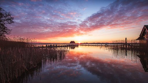 A scenic view of a lake during a beautiful sunset