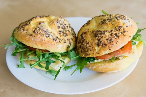 A high angle closeup shot of two sandwiches with bun bread on a white plate