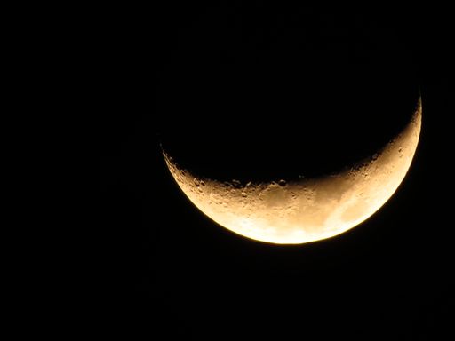 A beautiful shot of the half-moon in the dark space