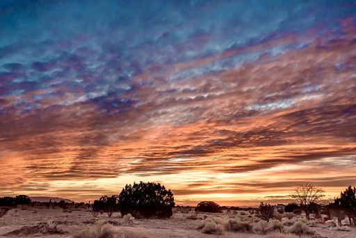 A breathtaking sunset over a field in Santa Fe, New Mexico