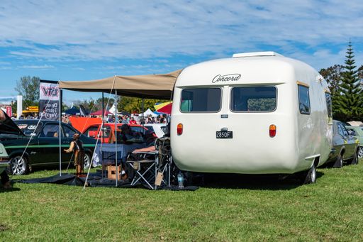 View of classic Concord camper caravan on green grass