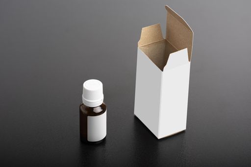 Children dietary supplement glass bottle with a package on a dark background, editable mock-up series ready for design, selection path included