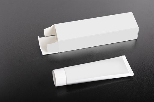 A rectangular box package mockup with a tube on the table, editable mock-up series template ready for design, faces selection path included