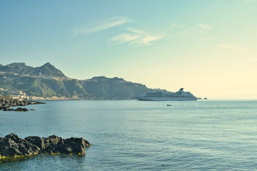 Sea bay in Giardini Naxos overlooking Taormina, Sicily, Italy