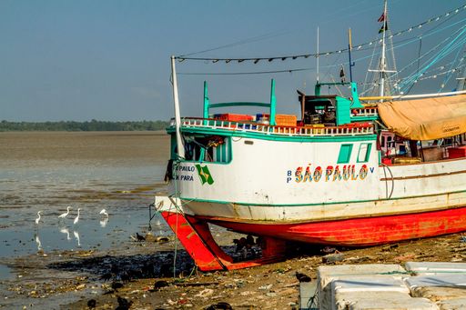 Boats docked near the Ver o Peso market at low tide