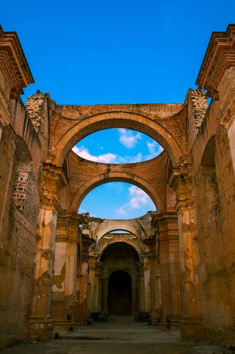 A vertical shot of the ruins of the cathedral of San Jose in Antigua Guatemala