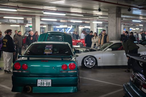 Rear view of a legendary green colored Nissan Skyline GT-R R34 at the Japanese Modified Car Concentration