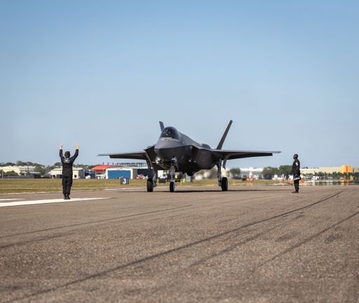 The members of the US Air Force F-35 Demonstration Team assisting a Lockheed Martin F-35 at an air show.