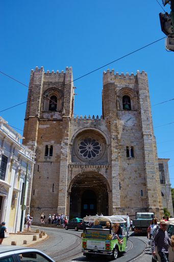 Vertical shot of Lisbon Cathedral during a hot bright sunny cloudless day