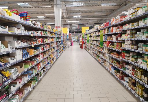 Shelves with different products at the Auchan store in Targu Mures city - Romania