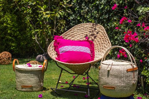 A Baskets made of palm leaves woven in the garden, a traditional handicraft product from Latin America and Mexico.