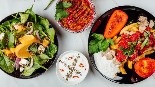 A top view of delicious gourmet dishes with different vegetables and meat