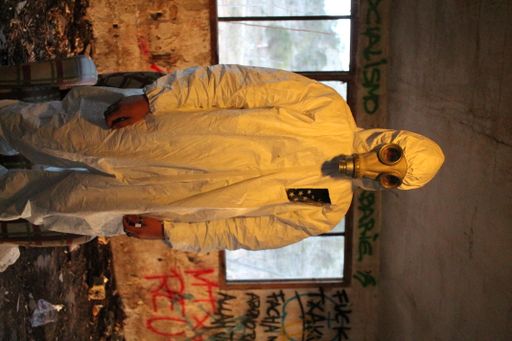 A male front liner wearing a personal protective equipment inside an abandoned building