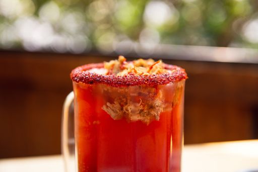 A selective focus shot of an orange Mexican beer cocktail mix