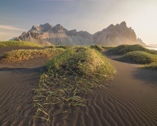 A scenic view of the majestic Vestrahorn mountain range at sunrise