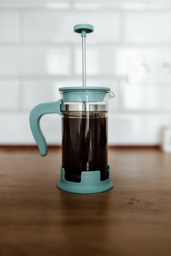 A vertical shot of coffee in french press on a table