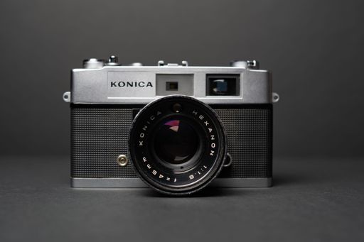 The Konica vintage rangefinder camera auto s 1.6 35mm on a black background.
