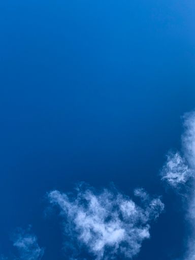 A beautiful shot of blue sky with thin clouds- free space for text