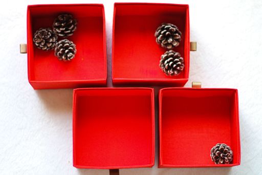 A top view of decorative cones in red boxes