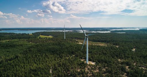 Wind power turbines in Finland, aerial, drone shot, on the Hogsara island, green energy mills, in the Fnnish archipelago