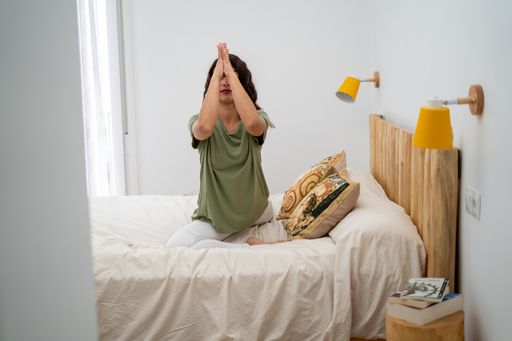 A closeup shot of a white Caucasian woman exercising in her room
