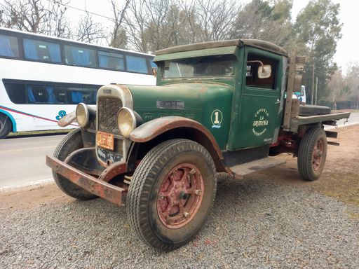 Uribelarrea, Argentina - Jul 15, 2023: old rusty unpainted 1932 Federal Motor classic flatbed truck in a rural road