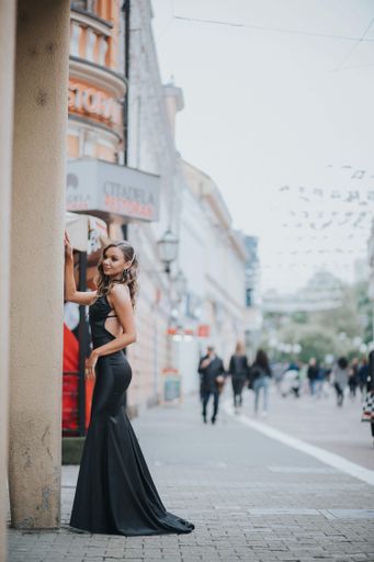 A young elegant Caucasian woman wearing a long black dress outdoors in Bosnia and Herzegovina