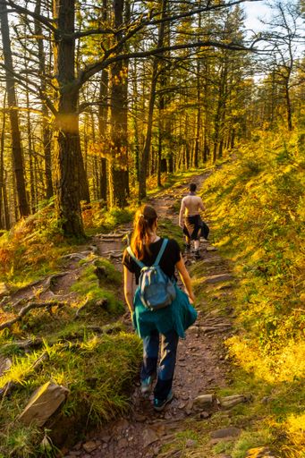A Spanish couple on the trail at sunset of Mount Adarra in Gipuzkoa, Basque Country