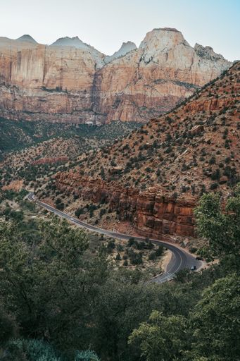 A breathtaking vertical shot of a scenic road winding through Zion National Park