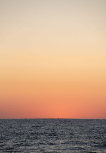 A beautiful sunset scene over the Baltic Sea in Palanga Beach, Lithuania