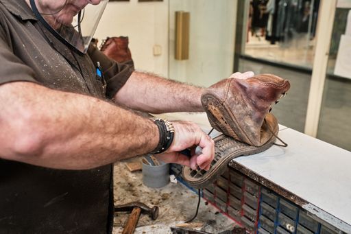 A shoemaker working in a workshop