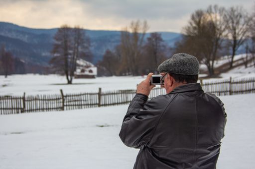 A man takes pic of the winter landscape