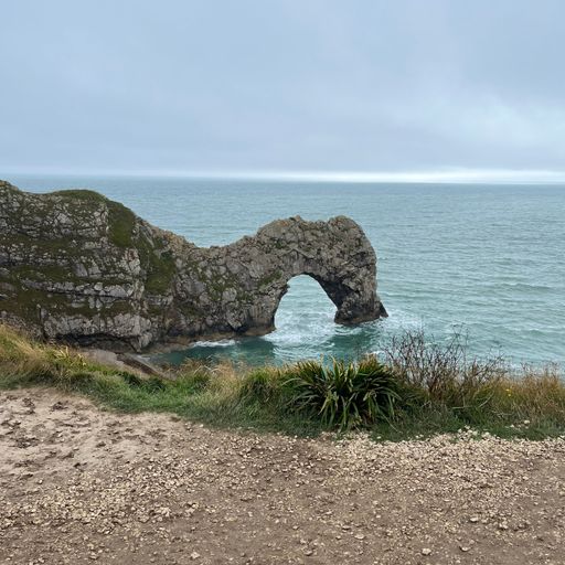 A stunning view of Durdle Door, an iconic limestone arch located on the shore of Weymouth, England