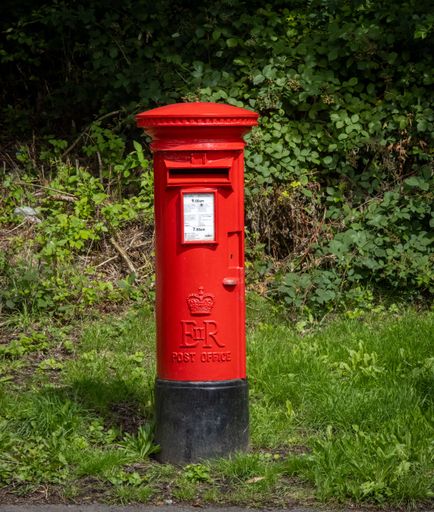 A red post box in Mountain Ash, South Wales.