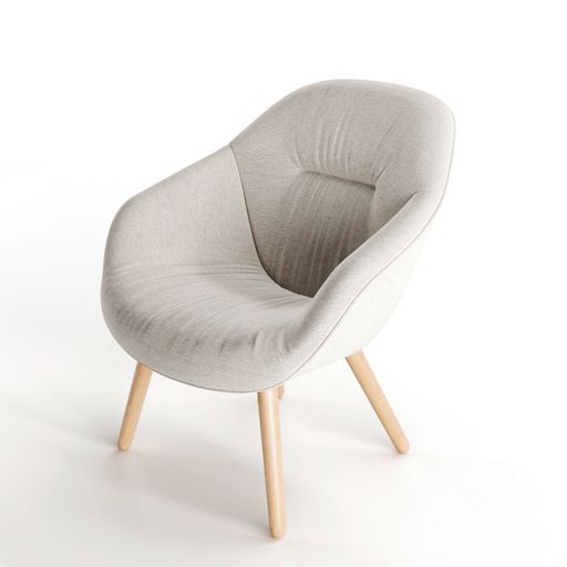 A minimalist grey armchair with four wooden legs sitting on a bright white background