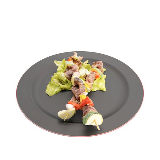 A white porcelain plate with a cooked meal of roasted vegetables and small cubes of meat, accompanied by a white fork on a white background
