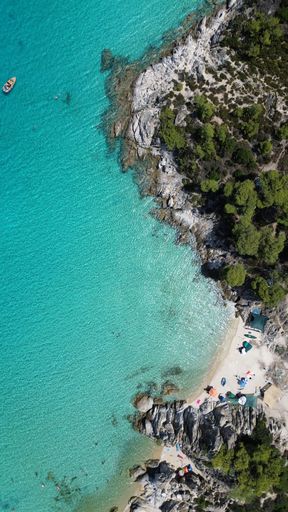 Drone footage captured with DJI MINI 3!

Aerial view of the shoreline of Paradise Beach, Sitonia, Greece 
with its crystal clear blue ocean water
