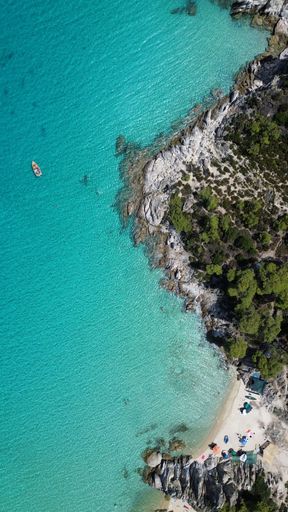 Drone footage captured with DJI MINI 3!

Aerial view of the shoreline of Paradise Beach, Sitonia, Greece 
with its crystal clear blue ocean water