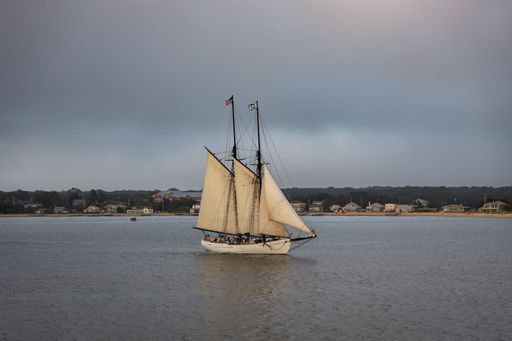 A vintage wooden schooner sailing across the waters near Martha's Vineyard