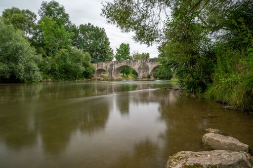 A beautiful arched stone bridge over the Pfunz Stream in Germany